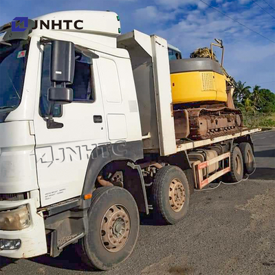 SINOTRUK HOWO 8X4 371hpの取り外し可能な貨物箱のダンプ トラックの平床式トレーラーの皿のダンプカー